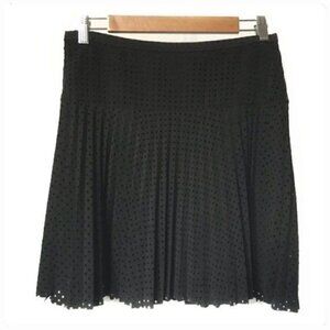 J. Crew Black pleated mini skirt in a technical laser-cut fabric. size 2